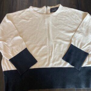 Two-tone sweater.